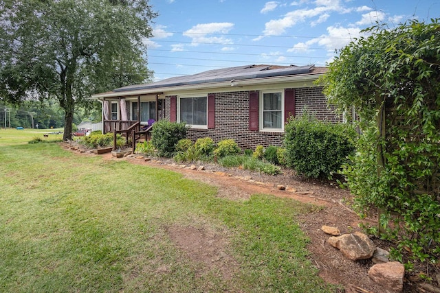 101 Jordan Rd, Lyman, SC 29365 - ranch-style house featuring a front yard, roof mounted solar panels, and brick siding