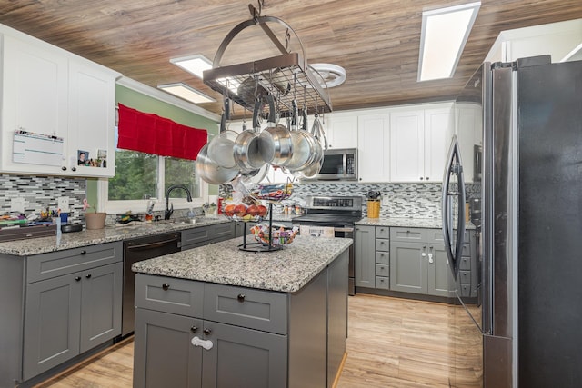 101 Jordan Rd, Lyman, SC 29365 - kitchen with stainless steel appliances, gray cabinets, tasteful backsplash, wooden ceiling, and crown molding