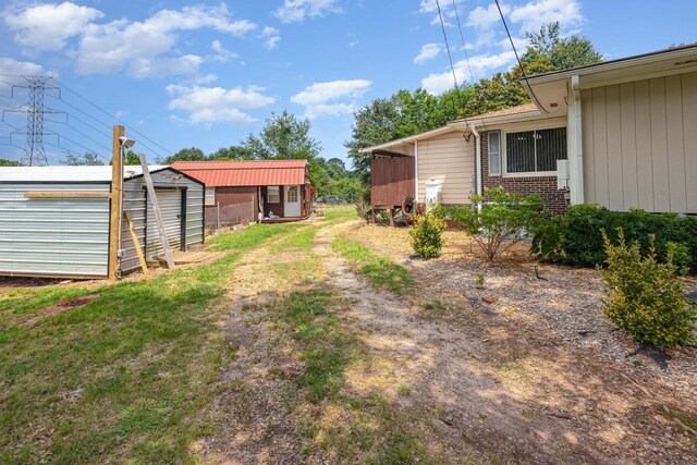 101 Jordan Rd, Lyman, SC 29365 - view of yard with a storage unit and dirt driveway