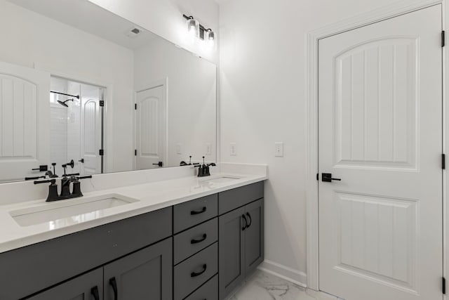 740 Enoree River Pl, Greer, SC 29651 - bathroom featuring double vanity, marble look tiles, and a shower