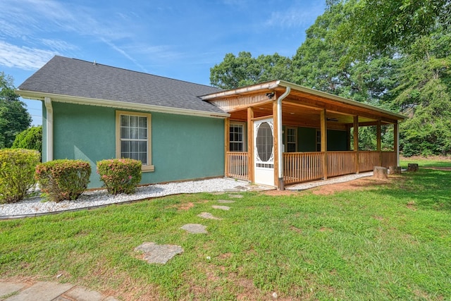 203 Palmetto Dr, Greer, SC 29651 - view of front facade with stucco siding, a front lawn, and roof with shingles