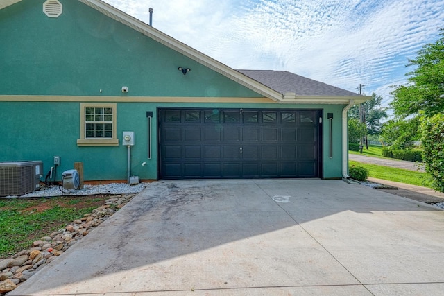 203 Palmetto Dr, Greer, SC 29651 - view of side of property featuring concrete driveway, a garage, and stucco siding