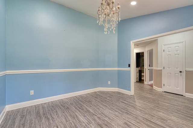 203 Palmetto Dr, Greer, SC 29651 - unfurnished room featuring a chandelier, wood finished floors, and recessed lighting