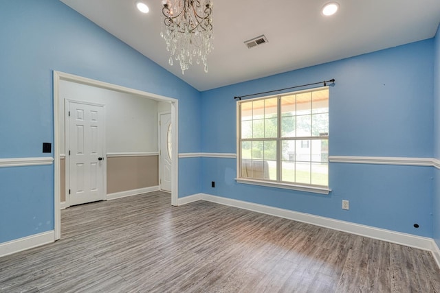 203 Palmetto Dr, Greer, SC 29651 - unfurnished room featuring a chandelier, wood finished floors, lofted ceiling, and recessed lighting