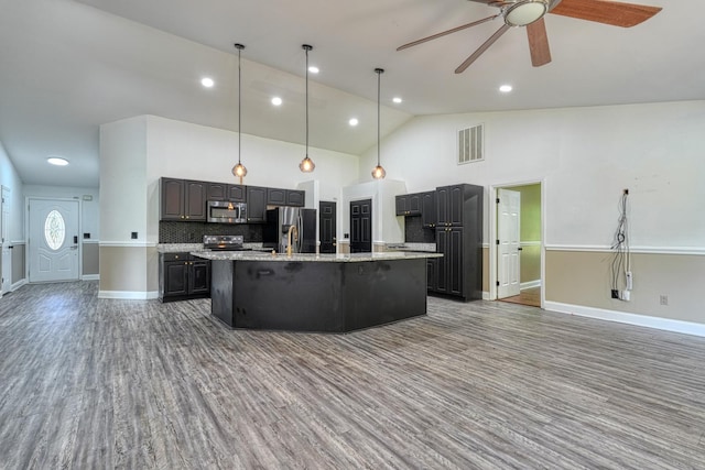 203 Palmetto Dr, Greer, SC 29651 - kitchen with stainless steel appliances, ceiling fan, a large island, open floor plan, and backsplash