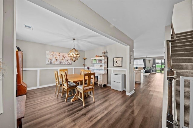 9035 Germaine Ct, Boiling Springs, SC 29316 - dining room featuring dark wood-style floors, stairs, and a chandelier