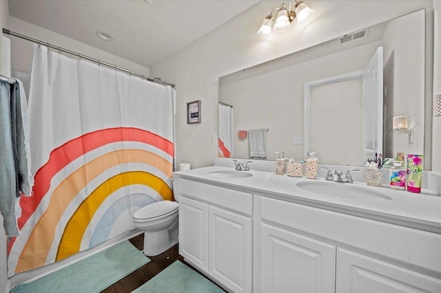 9035 Germaine Ct, Boiling Springs, SC 29316 - bathroom featuring double vanity, wood finished floors, and a shower with curtain