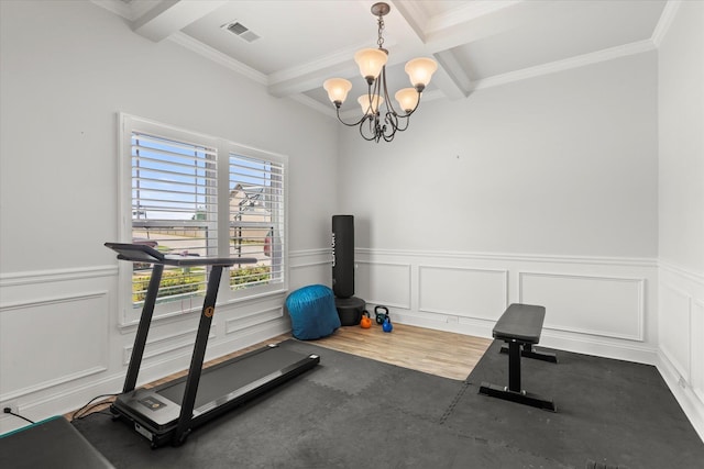 505 E Czardas Way, Woodruff, SC 29375 - exercise area featuring crown molding, a chandelier, a wainscoted wall, a decorative wall, and wood finished floors