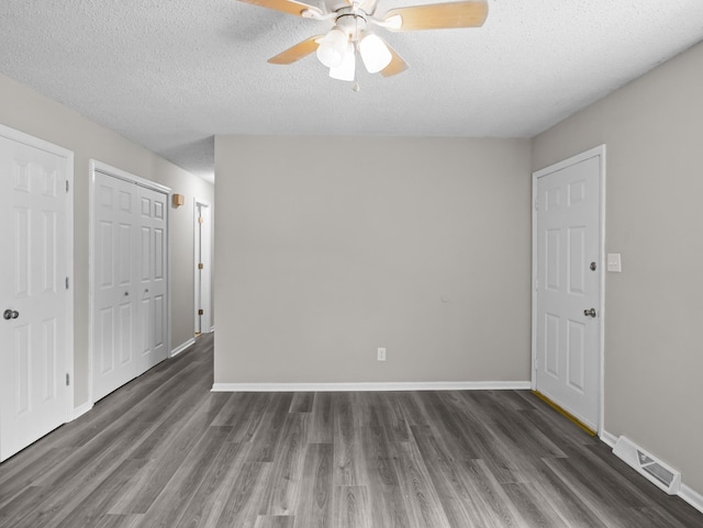 126 Loblolly Dr, Wellford, SC 29385 - unfurnished bedroom featuring wood finished floors, a textured ceiling, and ceiling fan