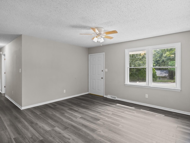 126 Loblolly Dr, Wellford, SC 29385 - spare room with ceiling fan, dark wood-style floors, and a textured ceiling