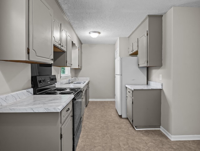 126 Loblolly Dr, Wellford, SC 29385 - kitchen featuring black range with electric cooktop, gray cabinets, light countertops, and a textured ceiling