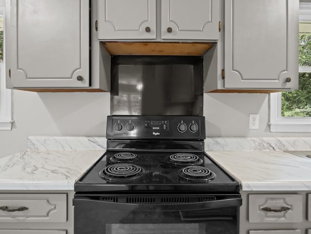 126 Loblolly Dr, Wellford, SC 29385 - kitchen with black / electric stove, light countertops, and white cabinetry