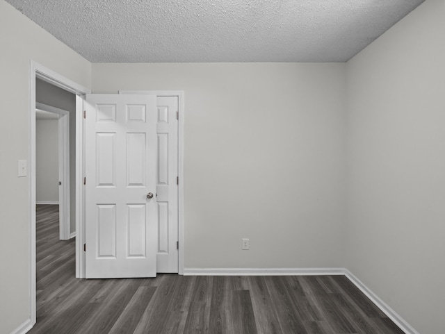 126 Loblolly Dr, Wellford, SC 29385 - empty room with dark wood-type flooring and a textured ceiling