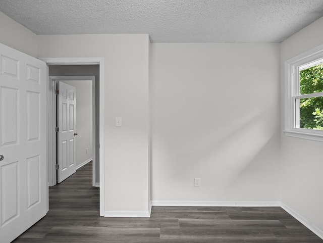 126 Loblolly Dr, Wellford, SC 29385 - unfurnished room with dark wood-type flooring and a textured ceiling