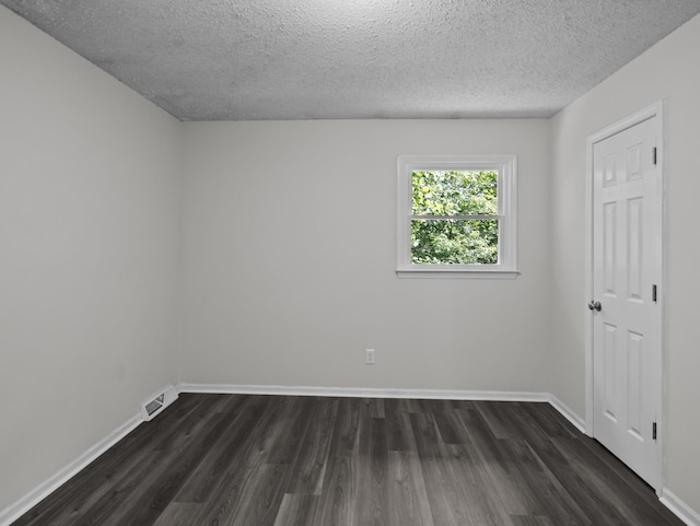 126 Loblolly Dr, Wellford, SC 29385 - unfurnished room with dark wood-type flooring and a textured ceiling