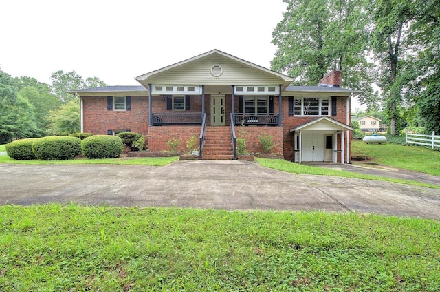 120 Branch St, Campobello, SC 29322 - view of front of property featuring covered porch, brick siding, stairway, and a chimney