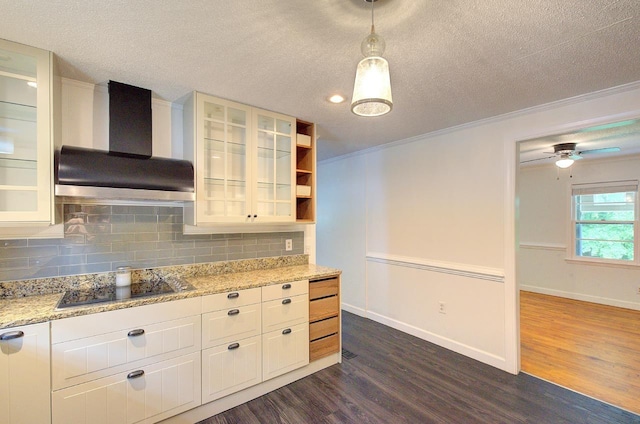 120 Branch St, Campobello, SC 29322 - kitchen with wall chimney exhaust hood, black electric cooktop, dark wood-type flooring, a textured ceiling, and tasteful backsplash