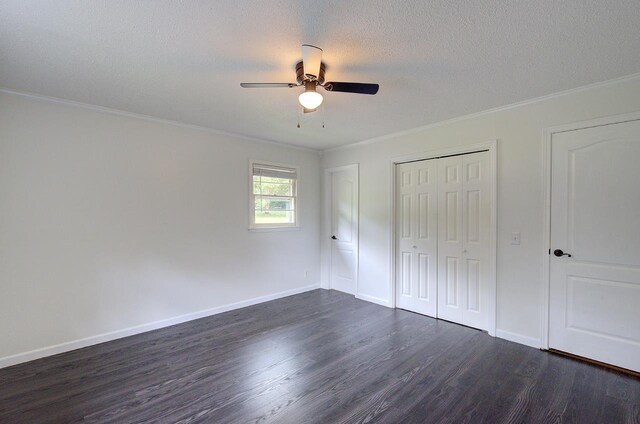 120 Branch St, Campobello, SC 29322 - unfurnished bedroom featuring dark wood-style flooring, crown molding, a closet, a textured ceiling, and ceiling fan