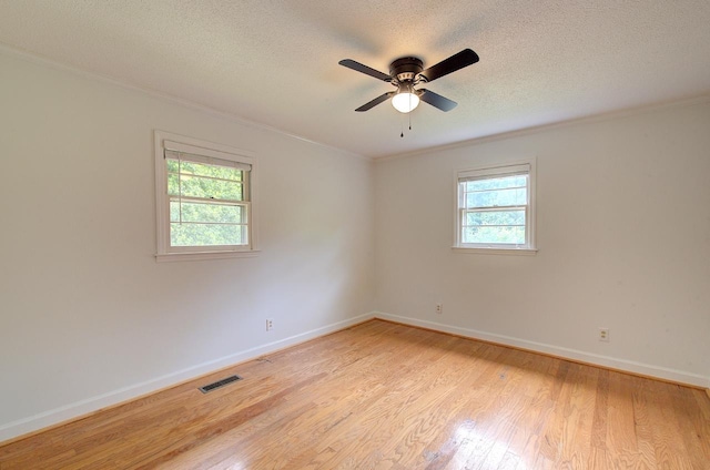 120 Branch St, Campobello, SC 29322 - unfurnished room with healthy amount of natural light, crown molding, a textured ceiling, light wood-type flooring, and a ceiling fan
