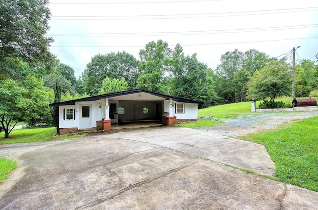 120 Branch St, Campobello, SC 29322 - view of front facade featuring concrete driveway, a front yard, and an attached carport