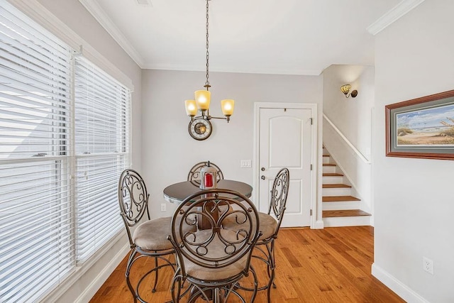 325 Reflection Dr, Lyman, SC 29365 - dining space featuring a chandelier, light wood-type flooring, stairs, and ornamental molding