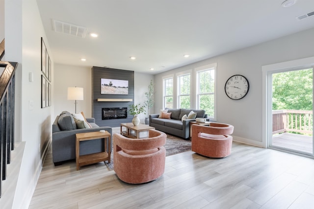 738 Judah Dr, Moore, SC 29369 - living room with healthy amount of natural light, light wood finished floors, a fireplace, and recessed lighting