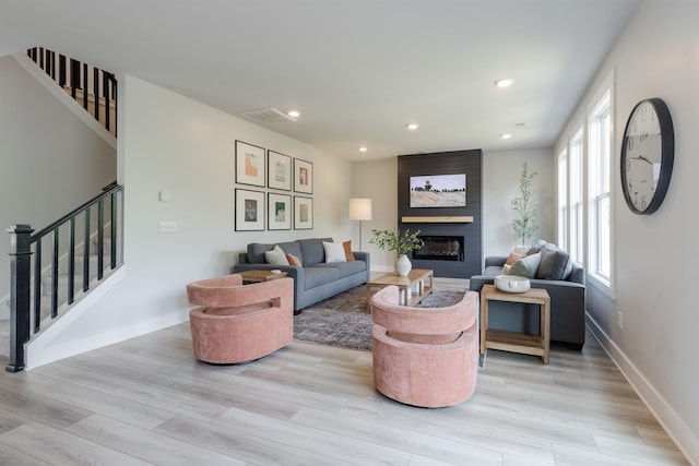 738 Judah Dr, Moore, SC 29369 - living area featuring stairs, light wood-type flooring, a fireplace, and recessed lighting