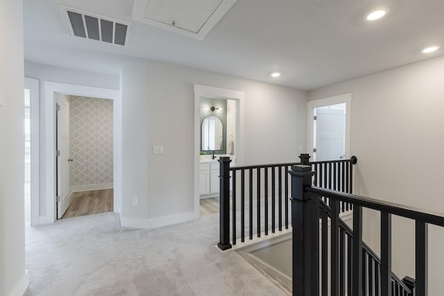 738 Judah Dr, Moore, SC 29369 - hallway with an upstairs landing, light colored carpet, recessed lighting, and attic access