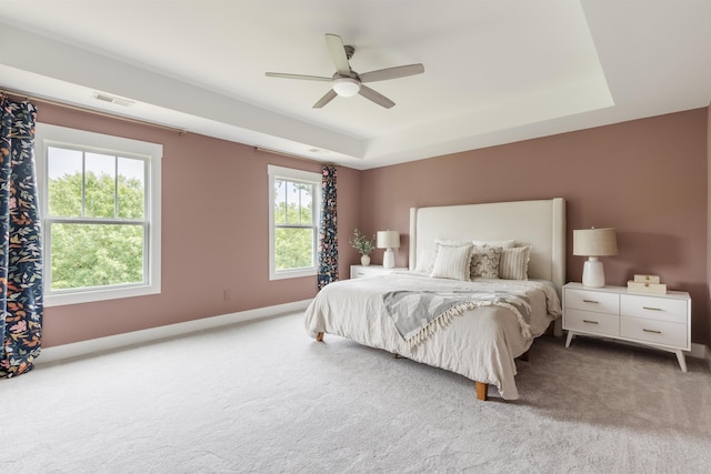 738 Judah Dr, Moore, SC 29369 - carpeted bedroom with a tray ceiling and ceiling fan