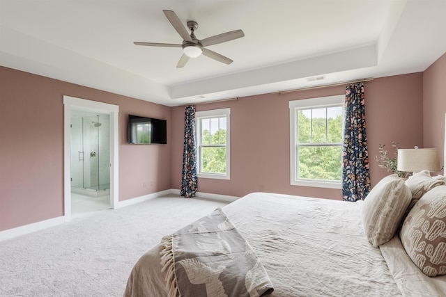 738 Judah Dr, Moore, SC 29369 - bedroom featuring light carpet, multiple windows, a tray ceiling, and connected bathroom