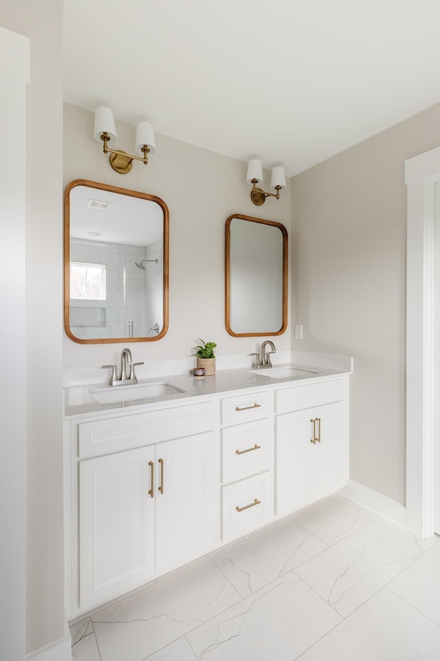 738 Judah Dr, Moore, SC 29369 - bathroom with marble look tiles, double vanity, and a shower