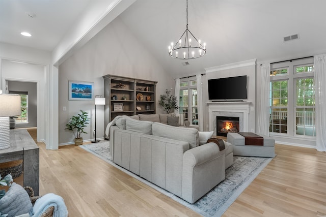 5 Modesto Ln, Simpsonville, SC 29681 - living room featuring a fireplace, light wood-style flooring, a chandelier, high vaulted ceiling, and recessed lighting