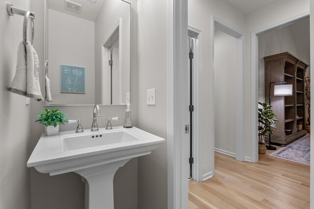 5 Modesto Ln, Simpsonville, SC 29681 - bathroom featuring wood finished floors and a sink