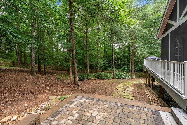 5 Modesto Ln, Simpsonville, SC 29681 - fenced backyard with a patio area and a forest view