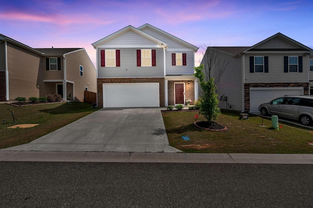 1808 Bridle Ln, Roebuck, SC 29376 - traditional home with a garage, concrete driveway, a front lawn, and brick siding