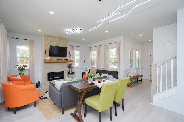 125 Patton St, Fountain Inn, SC 29644 - living room with light wood-type flooring, plenty of natural light, a large fireplace, recessed lighting, and stairs