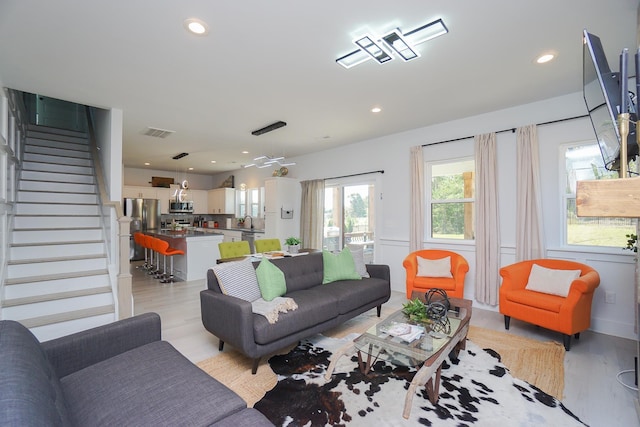 125 Patton St, Fountain Inn, SC 29644 - living area with light wood-style flooring, stairway, and recessed lighting