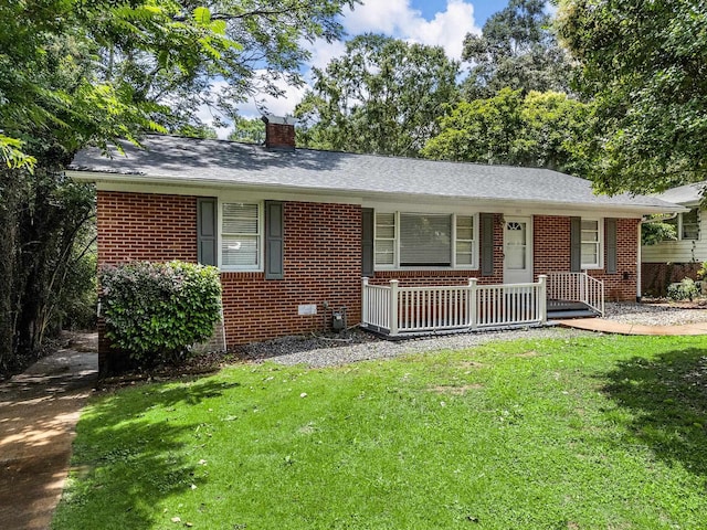 177 Continental Dr, Spartanburg, SC 29302 - view of front of house with covered porch, brick siding, and a chimney