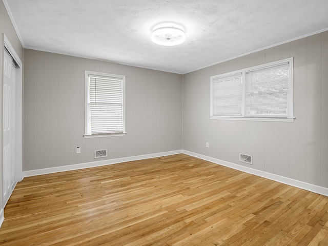 177 Continental Dr, Spartanburg, SC 29302 - spare room featuring light wood-style floors and crown molding