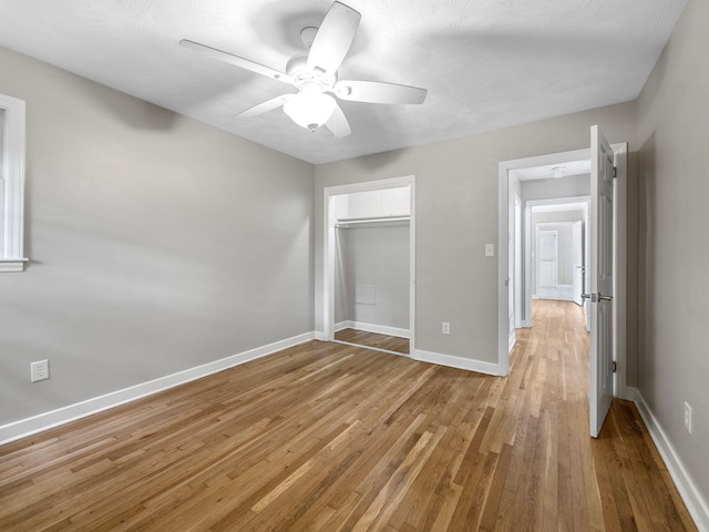 177 Continental Dr, Spartanburg, SC 29302 - unfurnished bedroom featuring light wood-type flooring, ceiling fan, and a closet