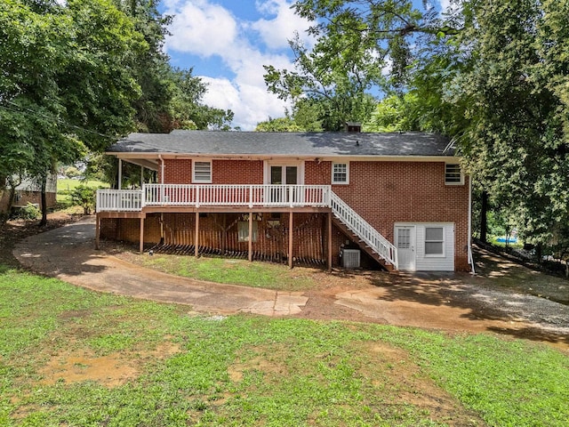 177 Continental Dr, Spartanburg, SC 29302 - rear view of property with stairs, brick siding, a wooden deck, and a yard