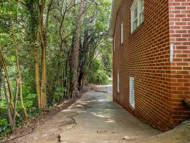 177 Continental Dr, Spartanburg, SC 29302 - view of side of property with brick siding and driveway