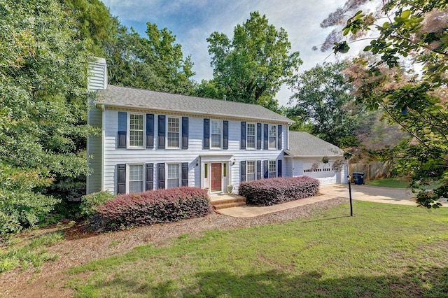 21 Glen Eagle Pl, Spartanburg, SC 29301 - colonial home with a chimney, an attached garage, a front yard, and driveway