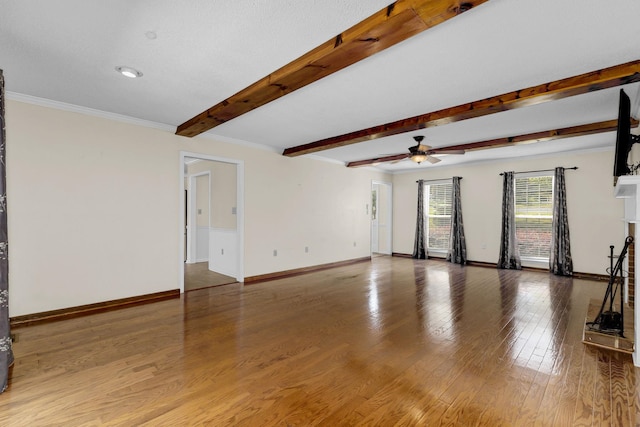 21 Glen Eagle Pl, Spartanburg, SC 29301 - unfurnished living room with ceiling fan, beam ceiling, wood finished floors, and ornamental molding