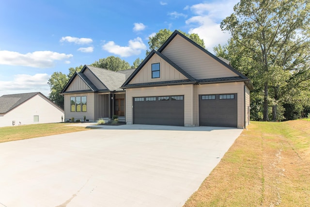 11555 New Cut Rd, Campobello, SC 29322 - view of front of house with driveway, a front yard, a garage, and board and batten siding