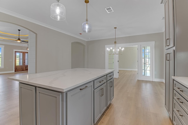 11555 New Cut Rd, Campobello, SC 29322 - kitchen with gray cabinets, arched walkways, a ceiling fan, light wood-type flooring, and a chandelier