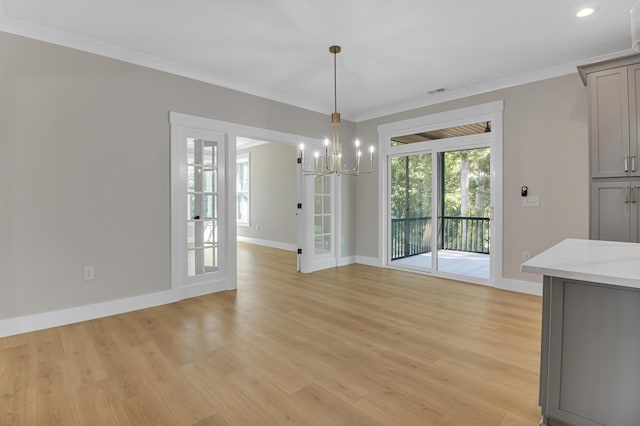 11555 New Cut Rd, Campobello, SC 29322 - unfurnished dining area with a chandelier, light wood-style flooring, and crown molding