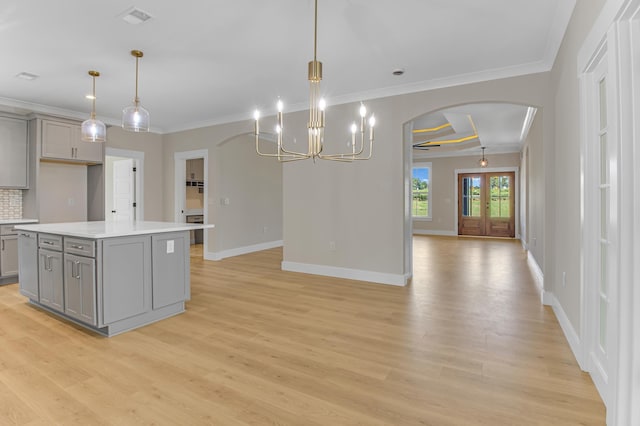 11555 New Cut Rd, Campobello, SC 29322 - kitchen with gray cabinetry, arched walkways, ornamental molding, and light wood-style flooring