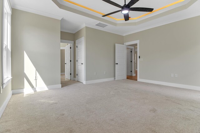 11555 New Cut Rd, Campobello, SC 29322 - spare room featuring a raised ceiling, a ceiling fan, carpet flooring, and ornamental molding