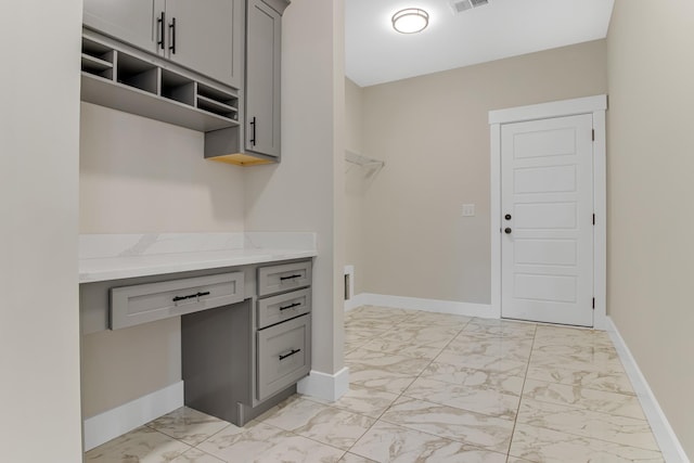 11555 New Cut Rd, Campobello, SC 29322 - interior space with light marble finish floors, gray cabinetry, open shelves, and light stone countertops